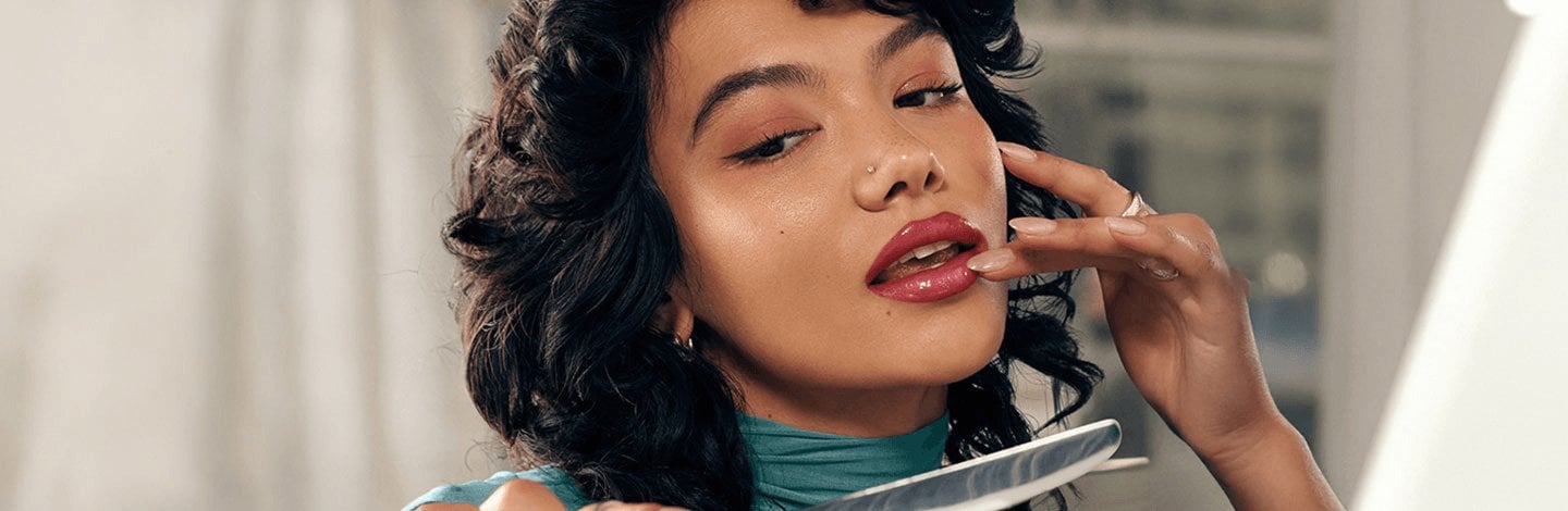 Woman with brown hair and drugstore makeup