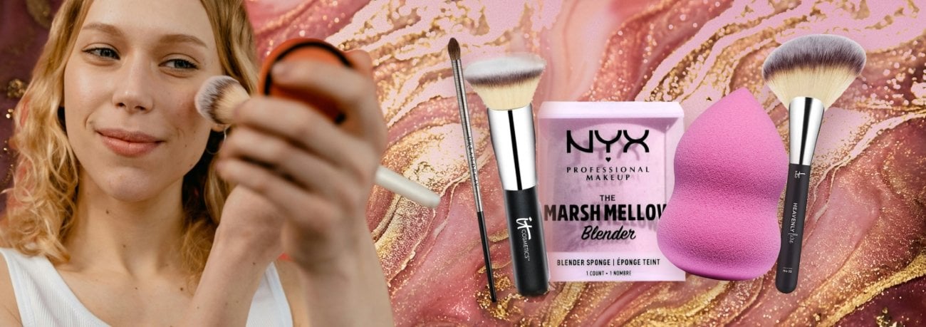 A close-up image of a women’s face as she applies makeup using a brush