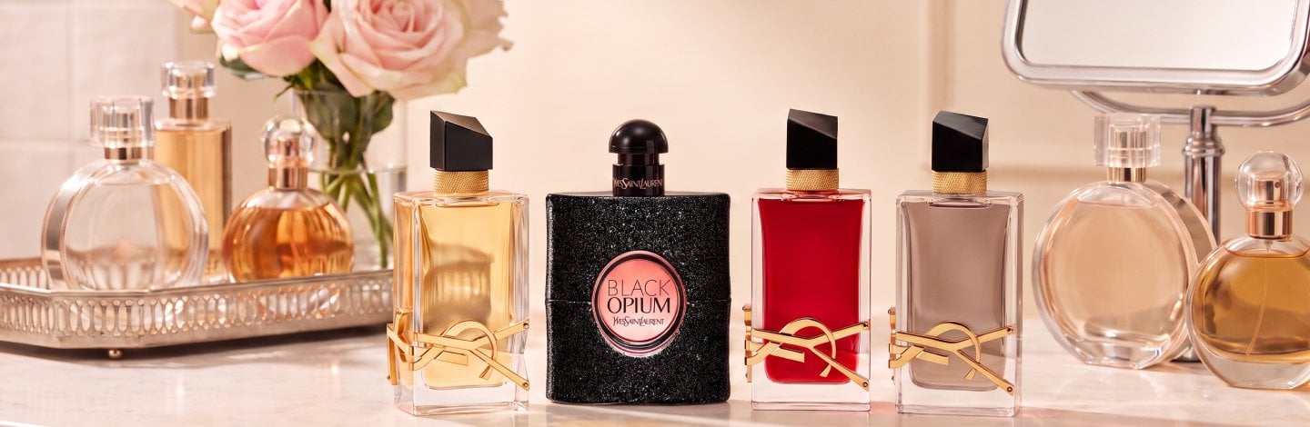 Product collage of YSL black opium, YSL libre, YSL Libre flower & flames, YSL Libre berry crush on a vanity
