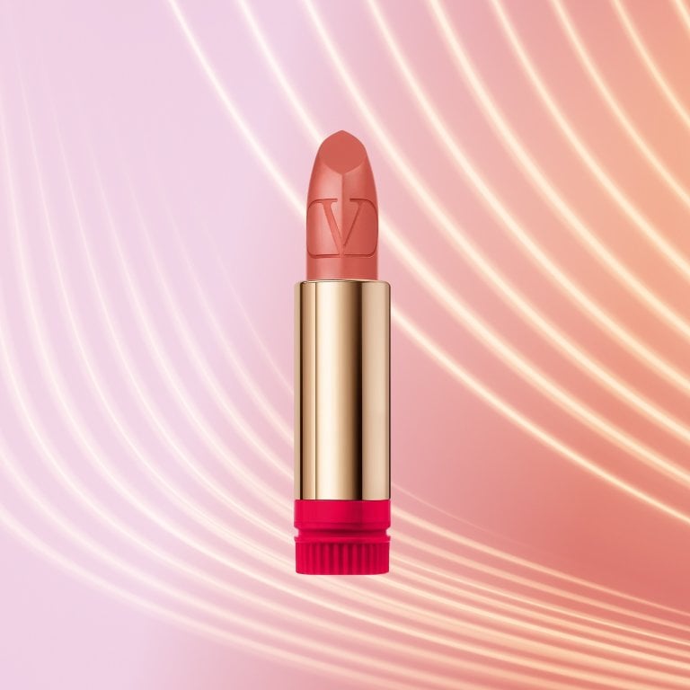 Valentino Beauty Rosso Valentino Lipstick on a textured background