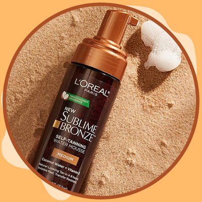 L’Oréal Paris Sublime Mousse photographed on a sandy background