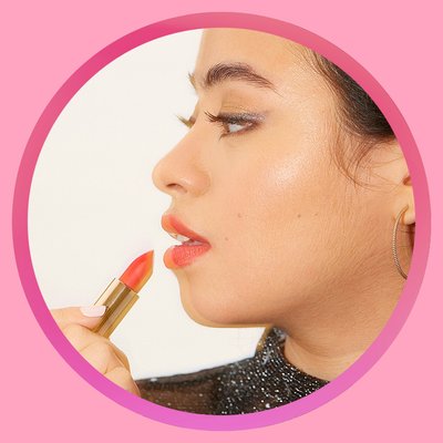 Model applying lipstick